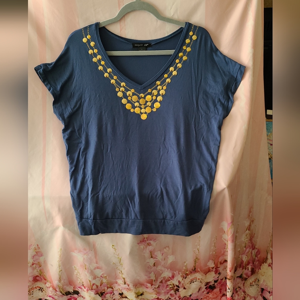 Greyish blue soft knit preowned top in excellent condition with GOLD foil